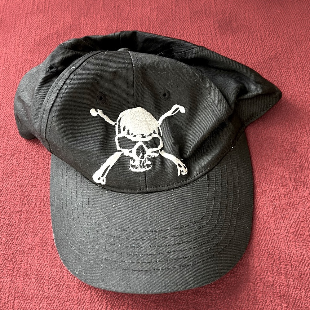 Marvin skull and cross bones hat with brim, adjustable strap in back